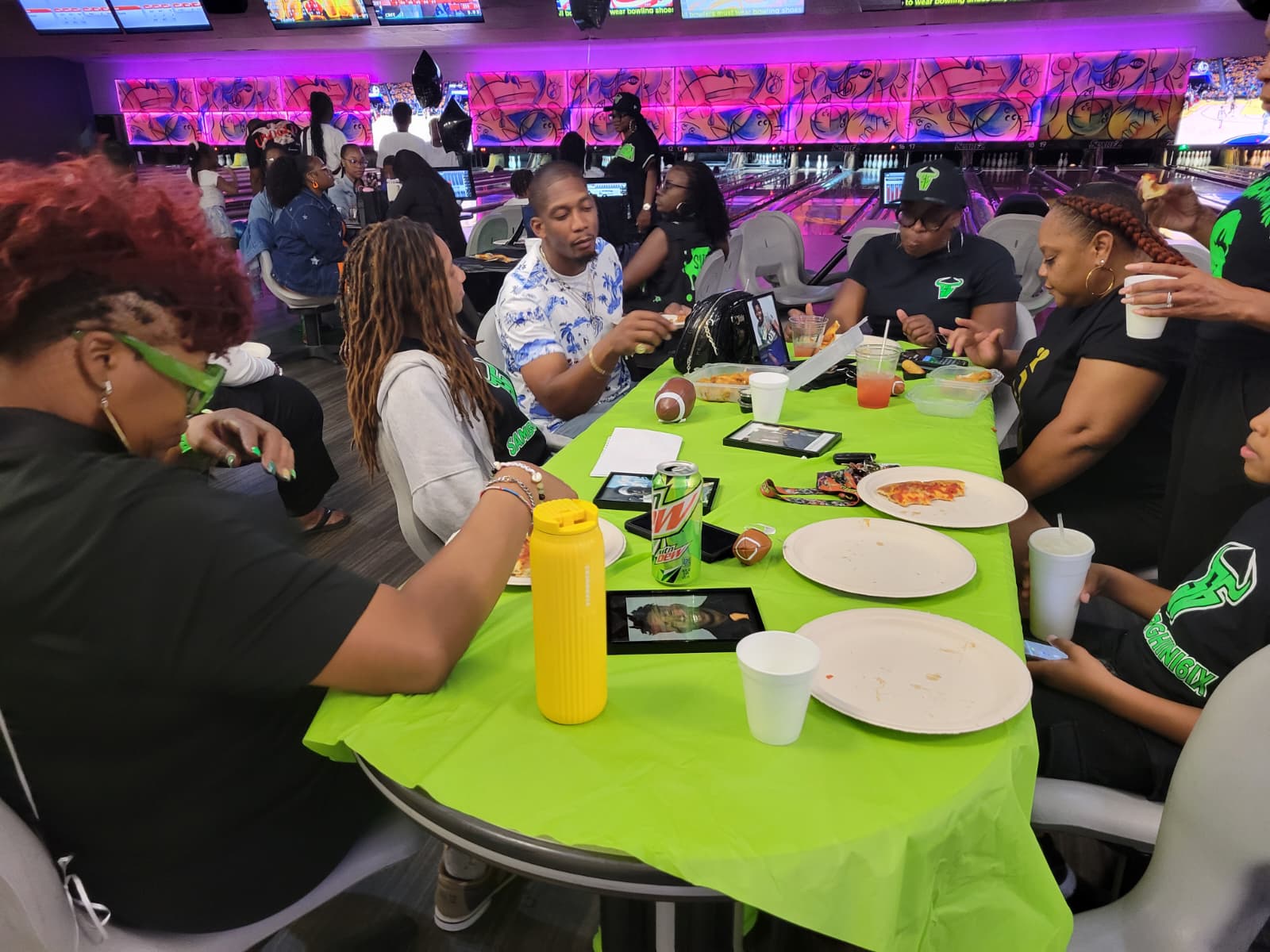 Family and friends bowling together